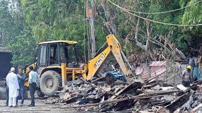 Bulldozers raze slum structures near gol chakkar Loni, in New Delhi on Wednesday (Sanjeev Verma/Hindustan Times) Bulldozers raze slum structures near gol chakkar Loni, in New Delhi on Wednesday (Sanjeev Verma/Hindustan Times)