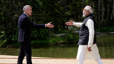 Canada's Prime Minister Mark Carney, and Prime Minister Narendra Modi reach to shake hands as Carney officially welcomes him to the G7 Summit in Kananaskis, Alberta. (AP) Canada's Prime Minister Mark Carney, and Prime Minister Narendra Modi reach to shake hands as Carney officially welcomes him to the G7 Summit in Kananaskis, Alberta. (AP)