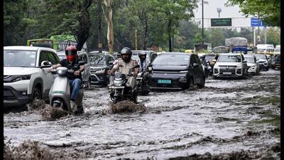 Commuters wade through a severely waterlogged road after rainfall near Vikas Marg, at ITO in New Delhi last month. Commuters wade through a severely waterlogged road after rainfall near Vikas Marg, at ITO in New Delhi last month.