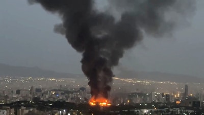 Smoke rises from a fire, as the Israel-Iran air war continues, in Tehran, Iran, in this still image obtained from social media video released June 17, 2025. (SOCIAL MEDIA via REUTERS)