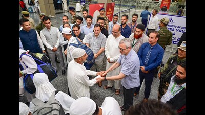 Jammu and Kashmir chief minister Omar Abdullah interacting with a Hajj pilgrim, at Srinagar International Airport on Tuesday. (ANI) Jammu and Kashmir chief minister Omar Abdullah interacting with a Hajj pilgrim, at Srinagar International Airport on Tuesday. (ANI)