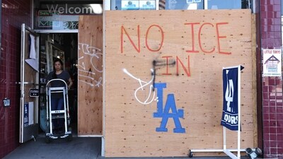 A business remains partially boarded up with a message reading "No ICE In LA" on the day the overnight curfew was lifted in downtown on June 17, 2025 in Los Angeles, California. (Getty Images via AFP) A business remains partially boarded up with a message reading "No ICE In LA" on the day the overnight curfew was lifted in downtown on June 17, 2025 in Los Angeles, California. (Getty Images via AFP)