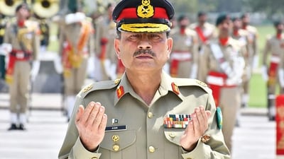 Field Marshal Syed Asim Munir prays after laying wreath on the martyrs' monument during a guard of honour ceremony at General Headquarters in Rawalpindi. (AFP file) Field Marshal Syed Asim Munir prays after laying wreath on the martyrs' monument during a guard of honour ceremony at General Headquarters in Rawalpindi. (AFP file)