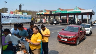 People register for FASTag at a Taswade toll plaza on the Pune-Bangalore national highway, in Karad on February 17. (PTI Photo)