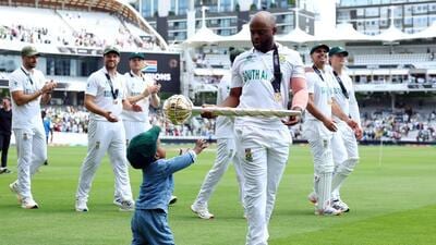 Temba Bavuma with his son while holding the ICC Test Championship Mace. (Reuters) Temba Bavuma with his son while holding the ICC Test Championship Mace. (Reuters)