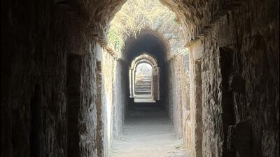 The silent, secretive tunnel-like corridor crawls through facing rows of darkened cells. (HT) The silent, secretive tunnel-like corridor crawls through facing rows of darkened cells. (HT)