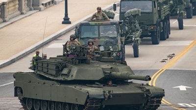 Members of the US Army drive a M1 Abrams tank across the Memorial Bridge during the Army 250th Anniversary Parade in Washington, DC, on June 14, 2025. (AFP)
