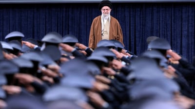Iran's Supreme Leader Ayatollah Ali Khamenei listens to the national anthem as Air Force officers salute during their meeting in Tehran, Iran. (REUTERS/File)
