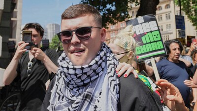 Liam Óg Ó hAnnaidh, aka Mo Chara, a member of the Irish language band Kneecap, leaves Westminster Magistrates Court London, (AP) Liam Óg Ó hAnnaidh, aka Mo Chara, a member of the Irish language band Kneecap, leaves Westminster Magistrates Court London, (AP)