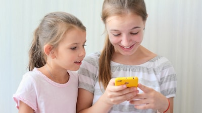 Children are glued to phones these days, which may slow down their developmental milestones. (Shutterstock) Children are glued to phones these days, which may slow down their developmental milestones. (Shutterstock)