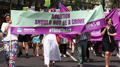 People march during a protest calling for abortion law reform in London, (REUTERS)