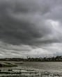 Dark monsoon clouds fill the sky above the River Hooghly in Nadia, West Bengal. (PTI) Dark monsoon clouds fill the sky above the River Hooghly in Nadia, West Bengal. (PTI)