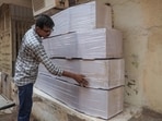 Nilesh Vaghela, a casket maker, shows coffins he made for the victims, who were killed in the Air India flight 171 crash, in Ahmedabad Nilesh Vaghela, a casket maker, shows coffins he made for the victims, who were killed in the Air India flight 171 crash, in Ahmedabad
