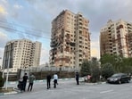 Residents watch a damaged apartment in Tehran, Iran, early Friday, June 13, 2025. Israel attacked Iran's capital early Friday, with explosions booming across Tehran. Residents watch a damaged apartment in Tehran, Iran, early Friday, June 13, 2025. Israel attacked Iran's capital early Friday, with explosions booming across Tehran.