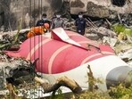 Wreckage of the crashed Air India plane being lifted by a crane, in Ahmedabad. Wreckage of the crashed Air India plane being lifted by a crane, in Ahmedabad.