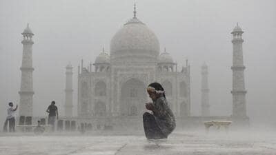 A child enjoying the rain at the Taj Mahal in Agra. (PTI) A child enjoying the rain at the Taj Mahal in Agra. (PTI)