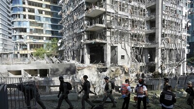escue workers and military personnel inspect the site of a direct hit from an Iranian missile strike in Ramat Gan, Israel, Thursday, June 19, 2025. (AP) escue workers and military personnel inspect the site of a direct hit from an Iranian missile strike in Ramat Gan, Israel, Thursday, June 19, 2025. (AP)