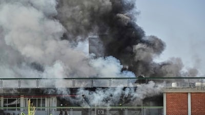 Firefighters work in a building of the Soroka hospital complex after it was hit by a missile fired from Iran in Be'er Sheva, Israel. (AP)
