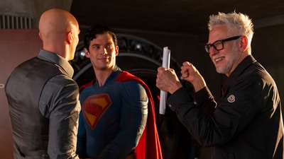 This image released by Warner Bros. Pictures shows Nicholas Hoult, left, David Corenswet, center, and director James Gunn on the set of "Superman." (Jessica Miglio/Warner Bros. Pictures via AP)