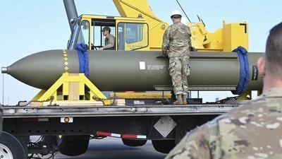 In this photo released by the U.S. Air Force on May 2, 2023, airmen look at a GBU-57, or the Massive Ordnance Penetrator bomb, at Whiteman Air Base in Missouri (US Air Force via AP, File)