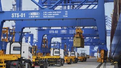 Huge cranes load containers onto trailers at Vizhinjam port in Thiruvananthapuram onJune 9, 2025. (AP FILE)