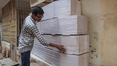 Nilesh Vaghela, a casket maker, shows coffins he made for the victims, who were killed in the Air India flight 171 crash, in Ahmedabad (AFP) Nilesh Vaghela, a casket maker, shows coffins he made for the victims, who were killed in the Air India flight 171 crash, in Ahmedabad (AFP)