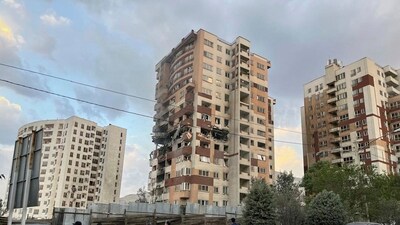 Residents watch a damaged apartment in Tehran, Iran, early Friday, June 13, 2025. Israel attacked Iran's capital early Friday, with explosions booming across Tehran. (AP File) Residents watch a damaged apartment in Tehran, Iran, early Friday, June 13, 2025. Israel attacked Iran's capital early Friday, with explosions booming across Tehran. (AP File)
