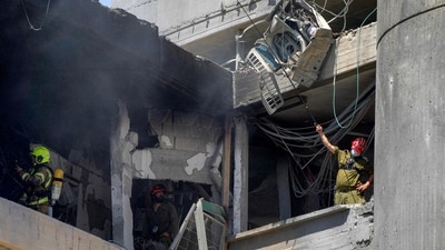 First responders inspect a heavily-damaged building at Soroka Hospital in Beersheba in southern Israel following an Iranian missile attack. (AFP) First responders inspect a heavily-damaged building at Soroka Hospital in Beersheba in southern Israel following an Iranian missile attack. (AFP)