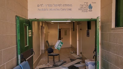Damage is seen after a building of the Soroka hospital complex was hit by a missile fired from Iran in Be'er Sheva, Israel. (AP) Damage is seen after a building of the Soroka hospital complex was hit by a missile fired from Iran in Be'er Sheva, Israel. (AP)