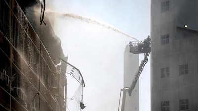 A firefighter extinguishes a blaze at Soroka Hospital in Beersheba in southern Israel following an Iranian missile attack. (AFP) A firefighter extinguishes a blaze at Soroka Hospital in Beersheba in southern Israel following an Iranian missile attack. (AFP)