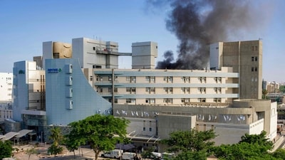 Smoke billows from a building at Soroka Hospital in Beersheba in southern Israel following an Iranian missile attack, on June 19, 2025. (AFP) Smoke billows from a building at Soroka Hospital in Beersheba in southern Israel following an Iranian missile attack, on June 19, 2025. (AFP)