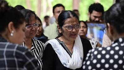 Mumbai, India - June 19, 2025: Rekha, mother of Late Clive Kunder, relatives and friend pay their last respect to Pilot Clive Kunder's mortal remains, who died in an Air India plane crash after a takeoff at Ahmedabad's Sardar Vallabhai Patel International airport, during funeral at Sewri Christian Cemetery, at Sewri in Mumbai, India, on Thursday, June 19, 2025. (Photo by Anshuman Poyrekar/ Hindustan Times) (Hindustan Times) Mumbai, India - June 19, 2025: Rekha, mother of Late Clive Kunder, relatives and friend pay their last respect to Pilot Clive Kunder's mortal remains, who died in an Air India plane crash after a takeoff at Ahmedabad's Sardar Vallabhai Patel International airport, during funeral at Sewri Christian Cemetery, at Sewri in Mumbai, India, on Thursday, June 19, 2025. (Photo by Anshuman Poyrekar/ Hindustan Times) (Hindustan Times)