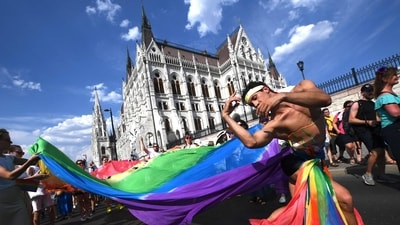 People take part in the LGBTIQA+ Pride Parade in Budapest in memory of the Stonewall Riots (AFP) People take part in the LGBTIQA+ Pride Parade in Budapest in memory of the Stonewall Riots (AFP)