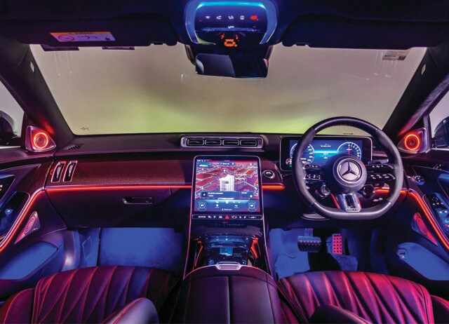 The central 12.8-inch touchscreen serves as the highly responsive control hub for every facet of the car.