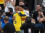 Former Indiana Pacers player Reggie Miller congratulates Tyrese Haliburton #0 of the Indiana Pacers after their 108-91 win in Game 6