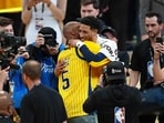 Former Indiana Pacers player Reggie Miller congratulates Tyrese Haliburton #0 of the Indiana Pacers after their 108-91 win against the Oklahoma City Thunder Game Six of the 2025 NBA Finals at Gainbridge Fieldhouse on June 19, 2025 in Indianapolis, Indiana.
