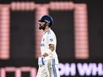 Virat Kohli walks back to the pavilion after his dismissal in a Test match.