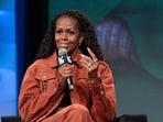 Michelle Obama discusses motherhood on her podcast, humorously reflecting on parenting with her brother Craig and Angie Martinez. 