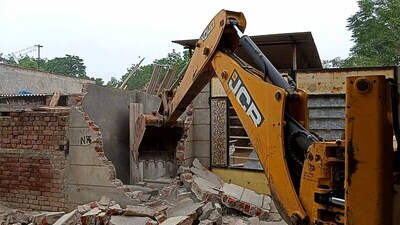 A peddler’s house being razed in Malaud, Khanna, on Friday. (HT photo)