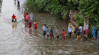 A waterlogged service road in Gurugram on June 17. (PTI) A waterlogged service road in Gurugram on June 17. (PTI)