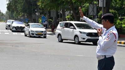 A Delhi Traffic Police personnel controls traffic in the national capital. (ANI file) A Delhi Traffic Police personnel controls traffic in the national capital. (ANI file)