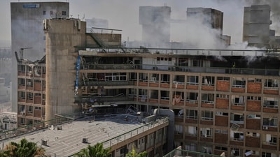 Smokes rises from a building of the Soroka hospital complex after it was hit by a missile fired from Iran in Beersheba, Israel on Thursday. (AP)