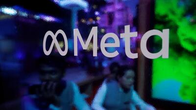 People are seen behind a logo of Meta platforms in India. (REUTERS File Photo) People are seen behind a logo of Meta platforms in India. (REUTERS File Photo)