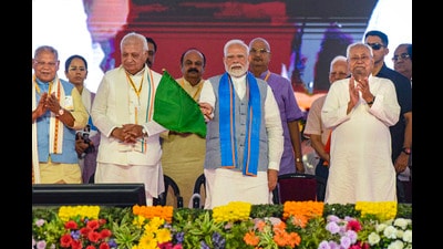 Prime Minister Narendra Modi, Bihar Governor Arif Mohammad Khan, Chief Minister Nitish Kumar, Union Minister Jitan Ram Manjhi and others during the inauguration and foundation stone laying of various development projects at a public meeting, in Siwan district, Bihar, on Friday. (PTI) Prime Minister Narendra Modi, Bihar Governor Arif Mohammad Khan, Chief Minister Nitish Kumar, Union Minister Jitan Ram Manjhi and others during the inauguration and foundation stone laying of various development projects at a public meeting, in Siwan district, Bihar, on Friday. (PTI)