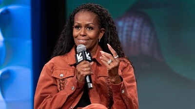 Michelle Obama discusses motherhood on her podcast, humorously reflecting on parenting with her brother Craig and Angie Martinez. (AFP) Michelle Obama discusses motherhood on her podcast, humorously reflecting on parenting with her brother Craig and Angie Martinez. (AFP)