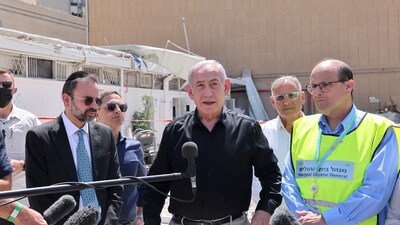 Israeli Prime Minister Benjamin Netanyahu visits the Soroka hospital complex, after it was hit by a missile fired from Iran. (REUTERS)