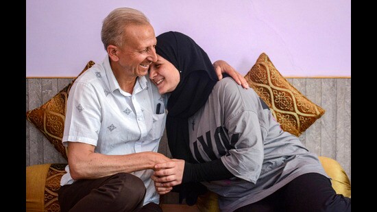 A MBBS student with her father after returning home in Srinagar on Friday. (PTI)
