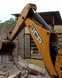 A peddler’s house being razed in Malaud, Khanna, on Friday. (HT photo) A peddler’s house being razed in Malaud, Khanna, on Friday. (HT photo)