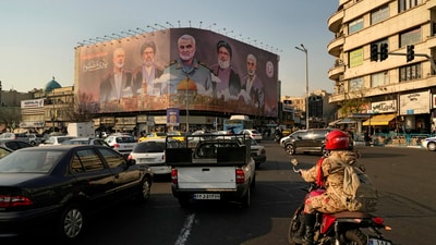 Vehicles drive on Islamix revolution square in Tehran, Iran. (AP File) Vehicles drive on Islamix revolution square in Tehran, Iran. (AP File)