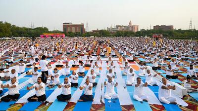People perform yoga at Helipad Ground Shivalik Park in Noida Sector 33A on Saturday. (Sunil Ghosh/HT Photo) People perform yoga at Helipad Ground Shivalik Park in Noida Sector 33A on Saturday. (Sunil Ghosh/HT Photo)